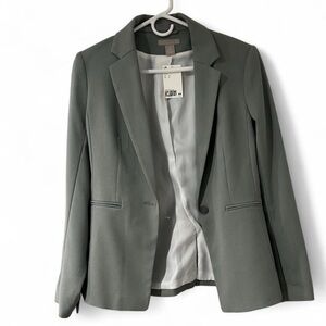 Women's pastel green size small blazer brand new.